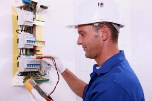 A picture of someone carrying out electrical testing at a residential property