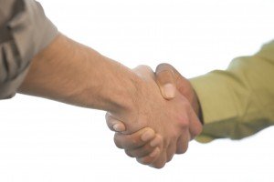 A picture of an electrical contractor shaking hands with someone