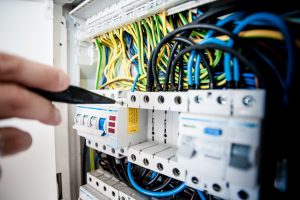 A picture of a worker carrying out an electrical installation