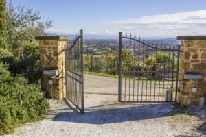 An image of electric gates, securing a large home in London.