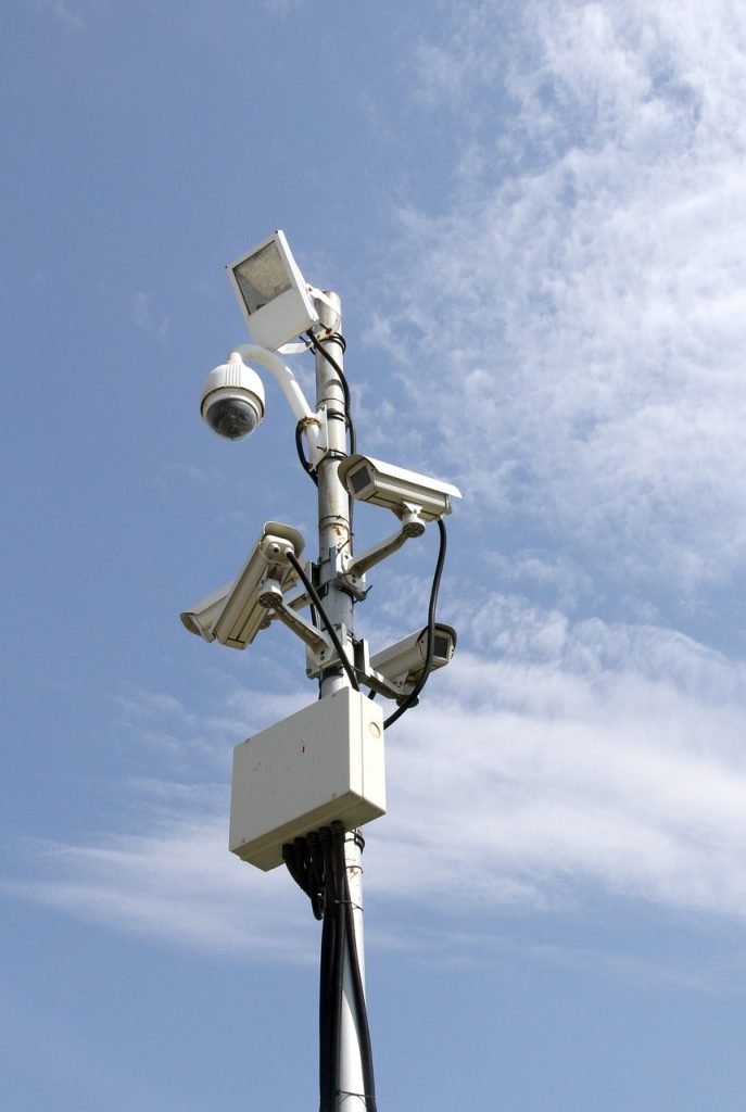 A picture of two office CCTV cameras