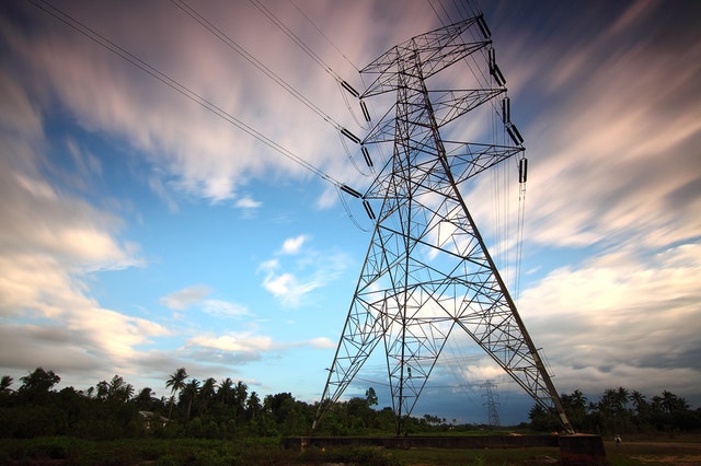 Image of a telephone pylon with multiple wires coming out of it