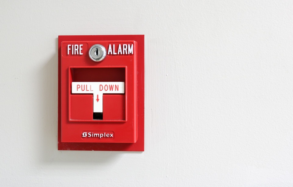 An image of fire alarm secured to a wall.