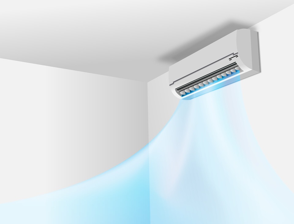 An image of a white air conditioning unit, installed in a domestic property.
